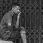 A thoughtful portrait of a man in Bangladesh, highlighting resilience and contemplation.