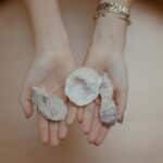 A person's hands holding healing crystals, perfect for meditation and mindfulness themes.