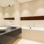 Sleek modern bathroom with double sinks and a stylish bathtub.