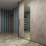 Elegant hallway with striped wallpaper and mirrored wardrobe, offering contemporary interior design inspiration.