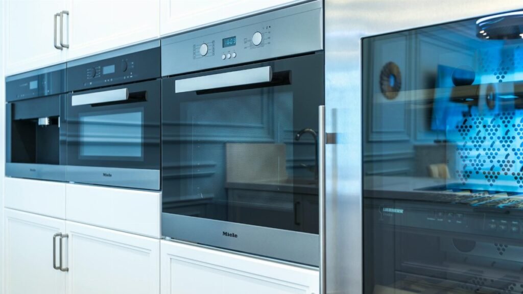Contemporary kitchen with built-in modern appliances showcasing sleek design.