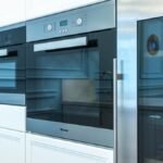 Contemporary kitchen with built-in modern appliances showcasing sleek design.