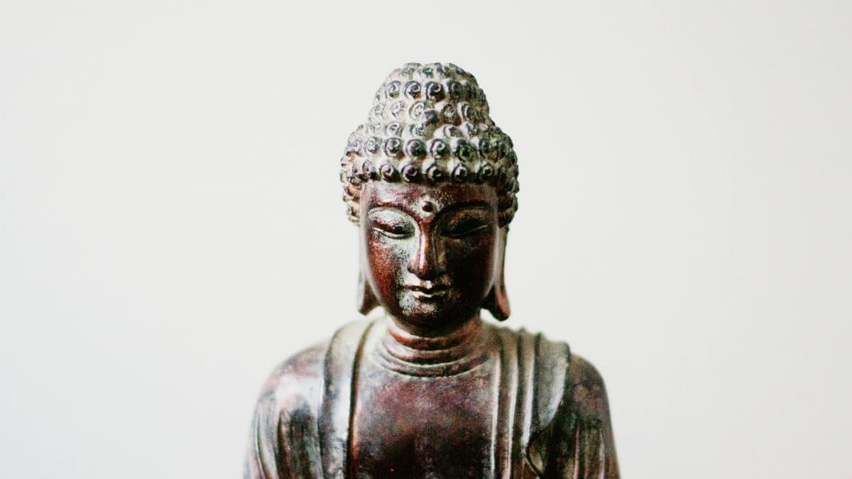 Detailed close-up of a Buddha statue embodying serenity and spiritual culture.