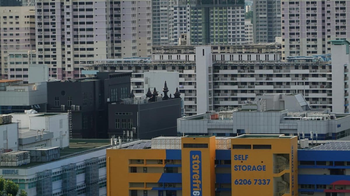 A view of dense residential buildings in Singapore showcasing urban living and self-storage facility.