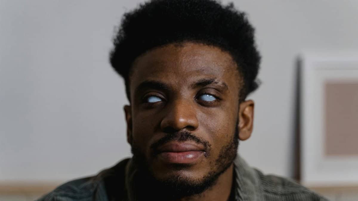 Close-up of a man with visual impairment demonstrating independence and strength.