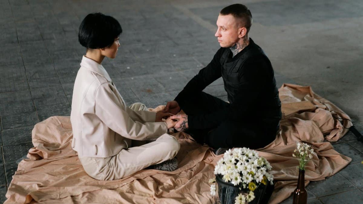 Two individuals having a calm interaction indoors, fostering connection and understanding.