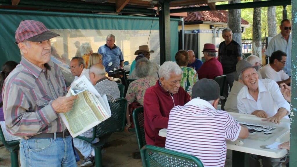 A group of seniors enjoying a lively game session outdoors in sunny Miami.