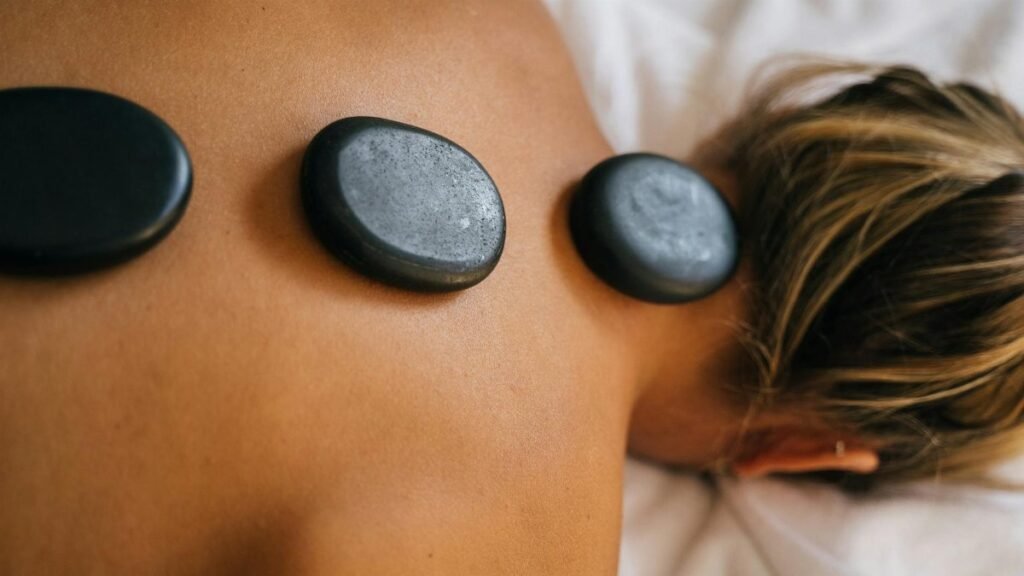 Peaceful spa setting with hot stone therapy promoting relaxation and relief.