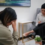 A therapist and client during a counseling session, focusing on mental health support.