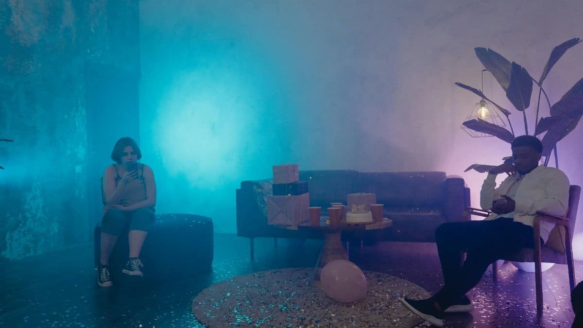 A stylish indoor party scene featuring smoke effects, diverse guests, and gift boxes.