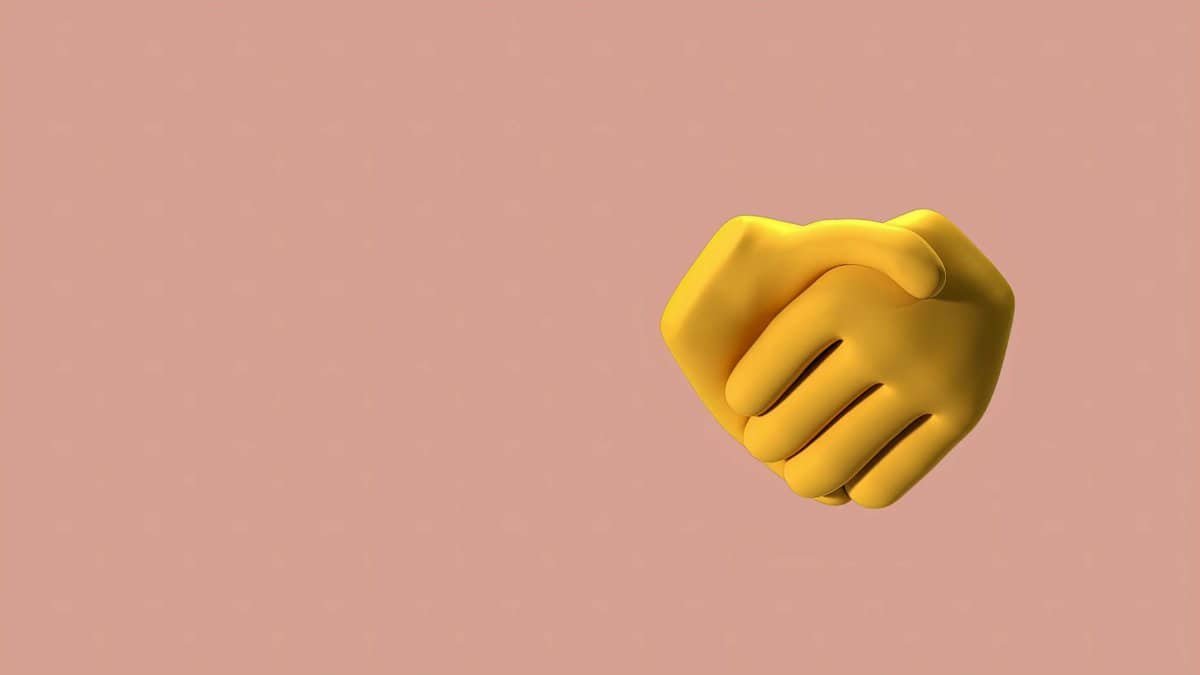 3D illustration of a yellow handshake emoji on a beige background, symbolizing agreement.