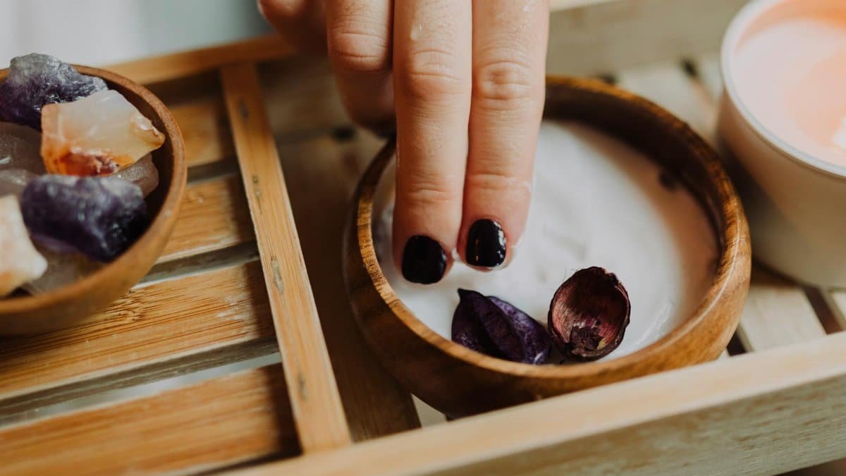 Indulge in a luxurious spa day with floral-infused hand treatments and natural crystals.
