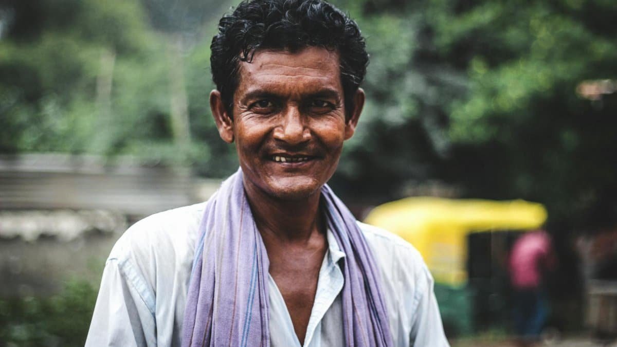 Portrait of a smiling man outdoors, capturing authentic emotion and cultural essence.