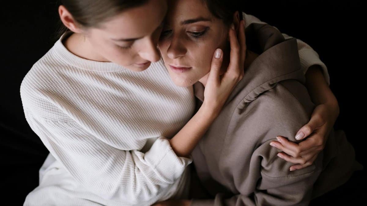 Two women embracing supportively, reflecting emotional bonding and comfort in difficult times.