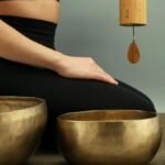 A tranquil scene featuring meditation with Tibetan singing bowls for relaxation and healing.
