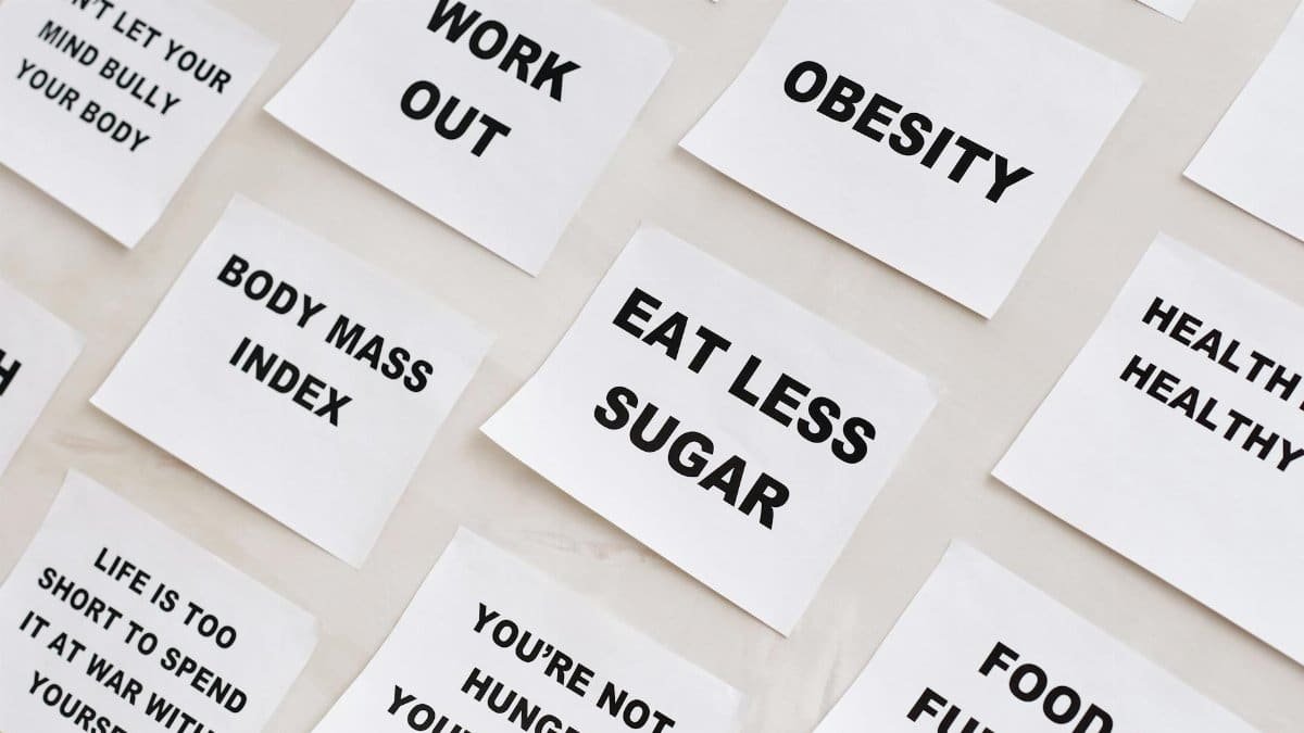 Collection of motivational notes promoting health and wellness found on paper notes.