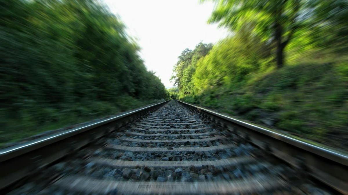 A dynamic view of railway tracks captured in motion with a long exposure effect.