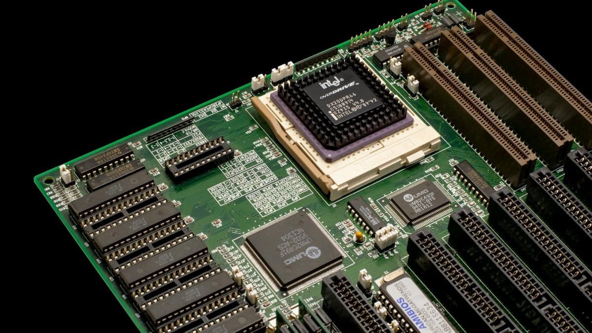 Detailed shot of a vintage motherboard showcasing microprocessor and electronic components.
