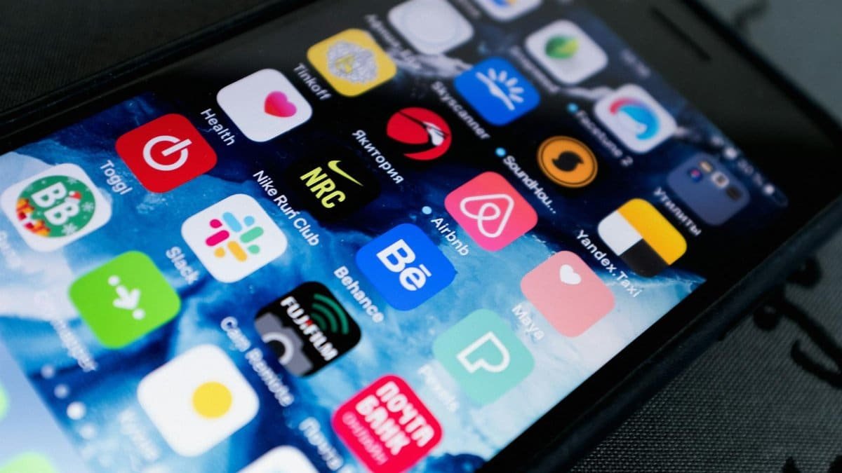 Detailed view of smartphone displaying multiple app icons on screen, highlighting technology use.