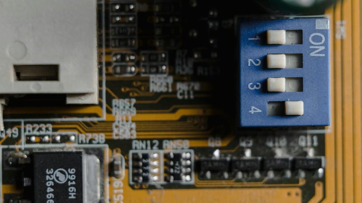 Detailed view of a circuit board showing switches and microchips.