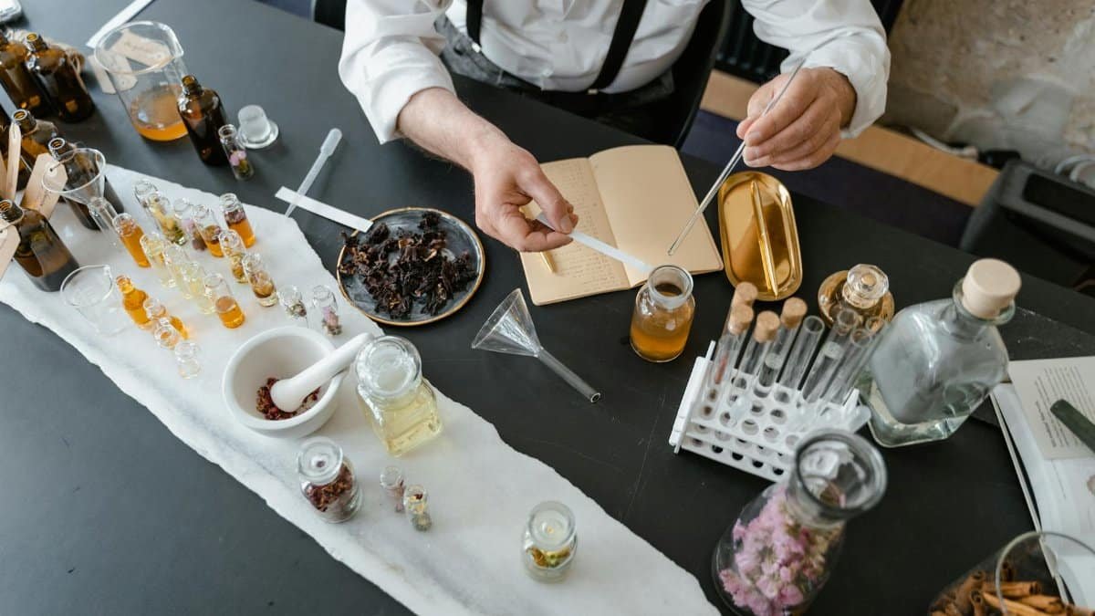 A detailed setup of an artisanal perfume-making process in a laboratory environment.