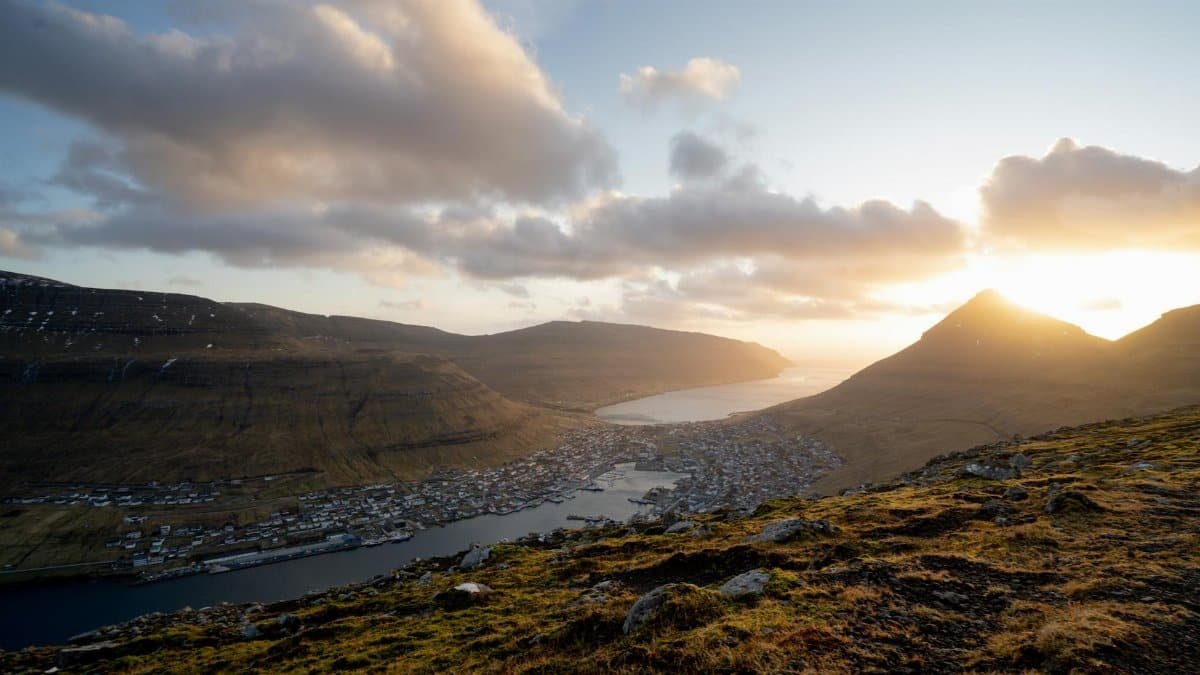Breathtaking view of fjord and mountains at sunrise in the Faroe Islands.