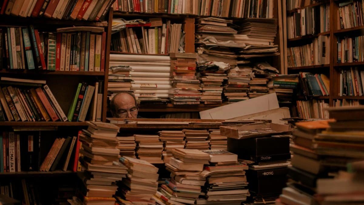 Explore a cluttered bookstore full of stacked books and hidden wisdom.