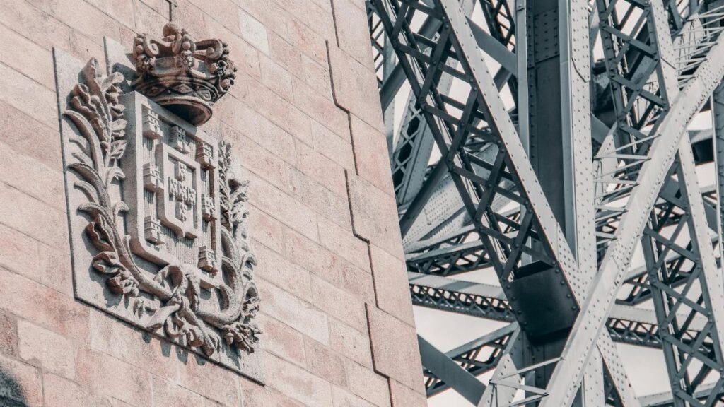 Close-up of the Ponte de Dom Luís I in Porto, showcasing intricate carvings and steel structure.