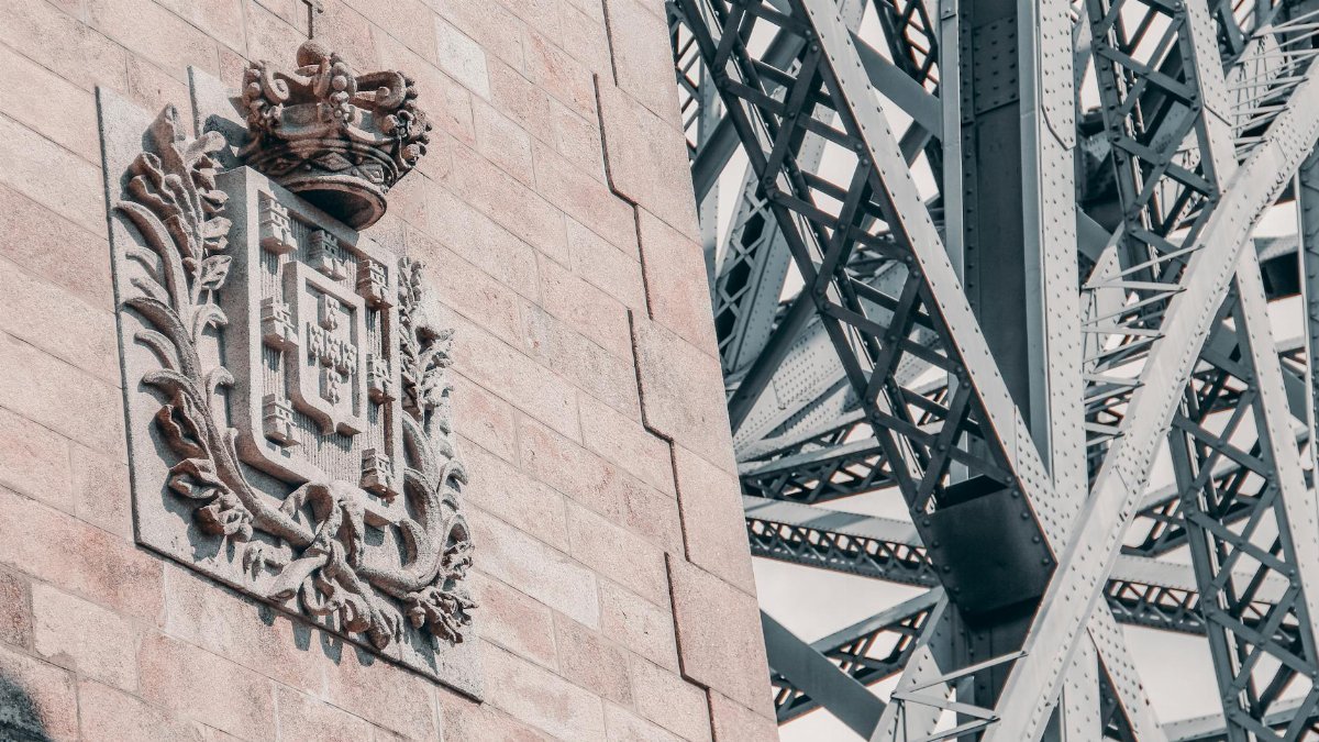 Close-up of the Ponte de Dom Luís I in Porto, showcasing intricate carvings and steel structure.