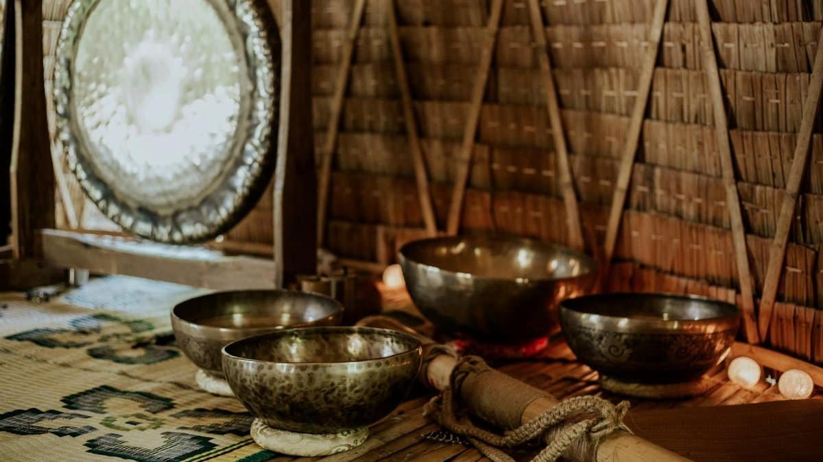 Tibetan singing bowls and gong for meditation and sound healing rituals.