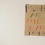 A motivational poster with the phrase 'Mistakes are proof you are trying.'