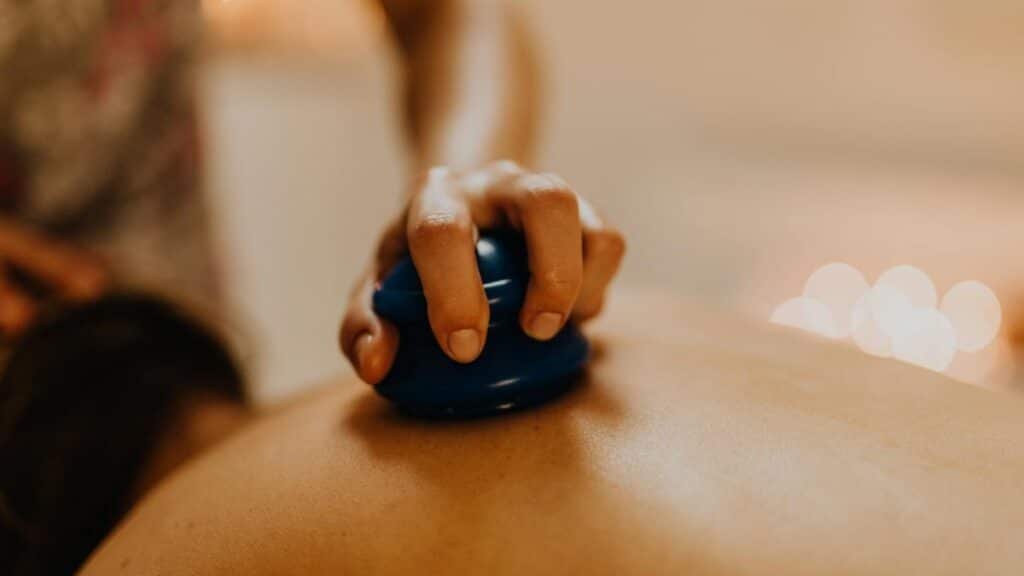 Close-up of cupping therapy on a person's back, focusing on relaxation and wellness.