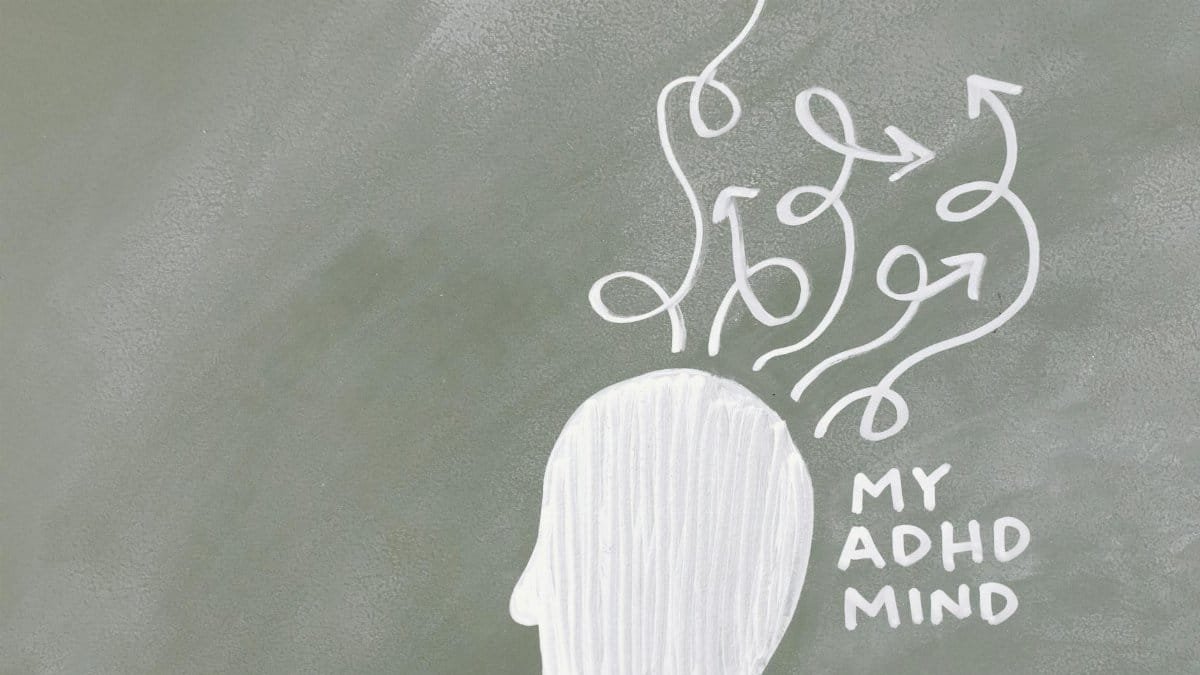 Creative depiction of the ADHD mind with chalk arrows on a green board.