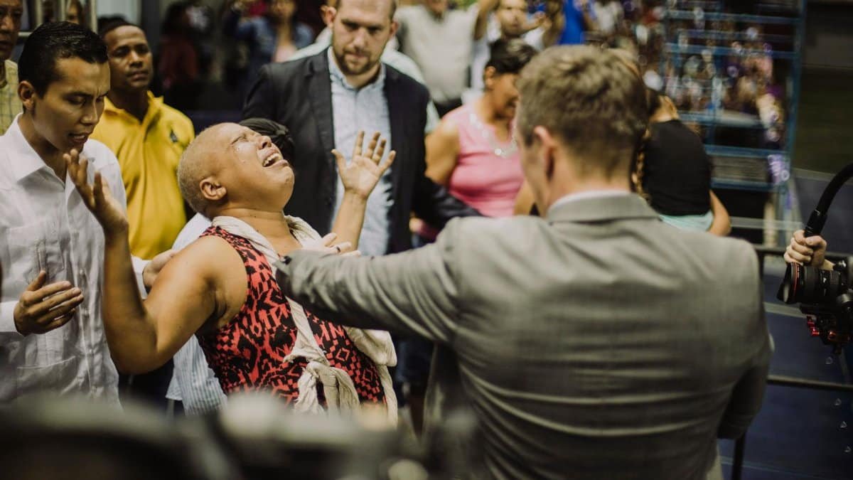 An emotional scene capturing intense expressions during a crowded event.