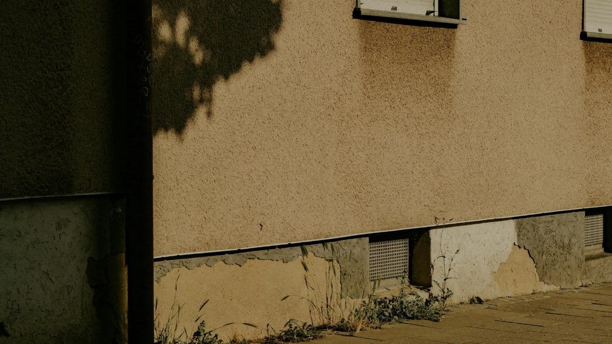 Captivating urban shadow play on a historic building wall in Kassel, Germany.