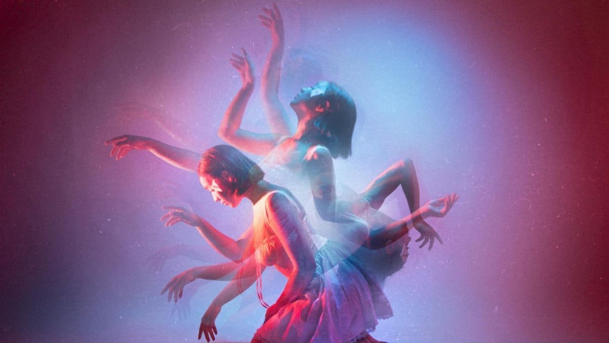 Artistic dance photo in studio with kinetic light effects and blurred motion.