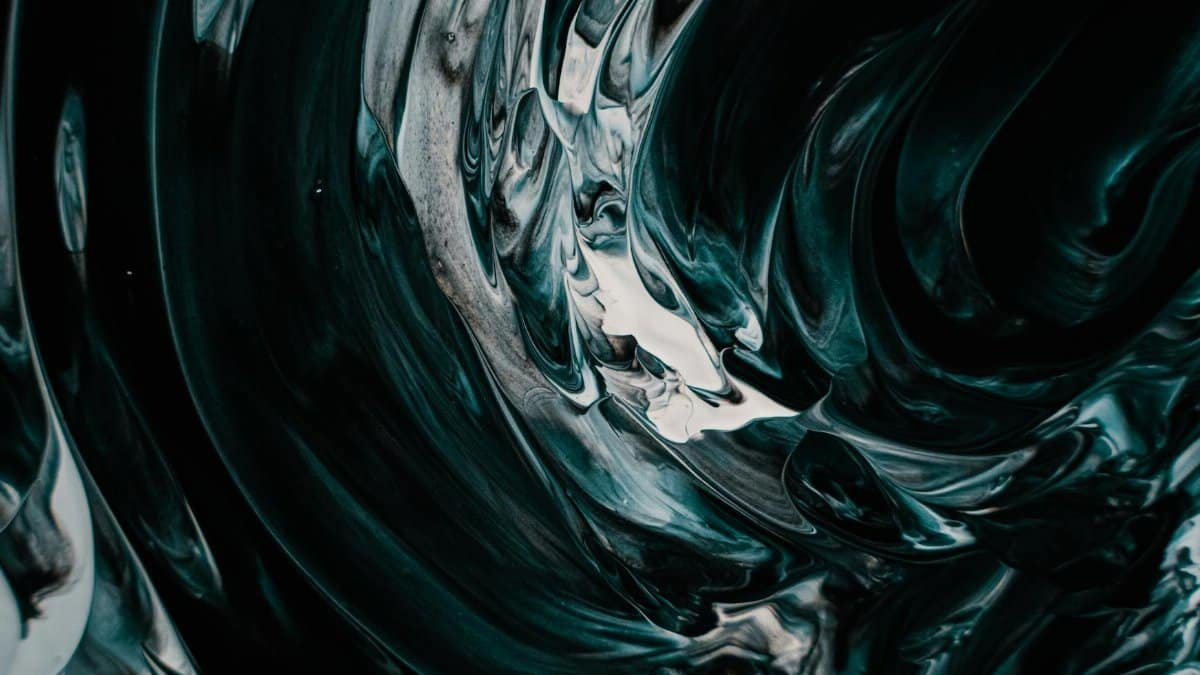 Stunning abstract image featuring swirling dark fluid designs in artistic expression.