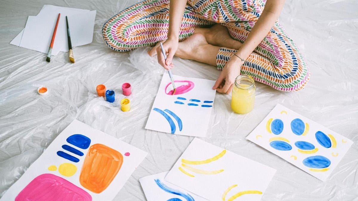 Creative watercolor painting session with vibrant colors and art supplies.