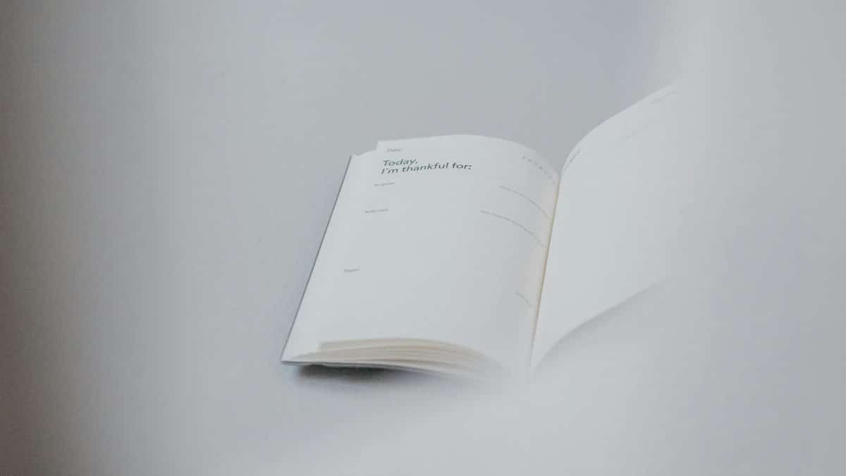 Open notebook displaying daily gratitude prompts, perfect for planning and reflection.