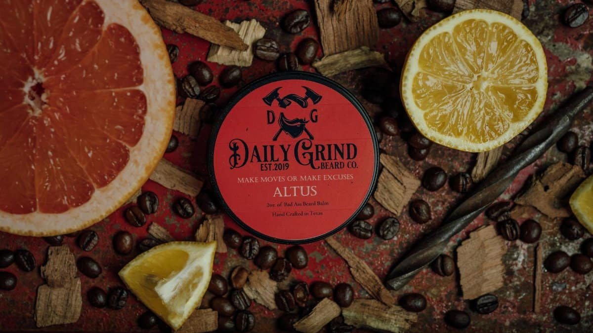 Beard balm with citrus and coffee beans for grooming and refreshing care.