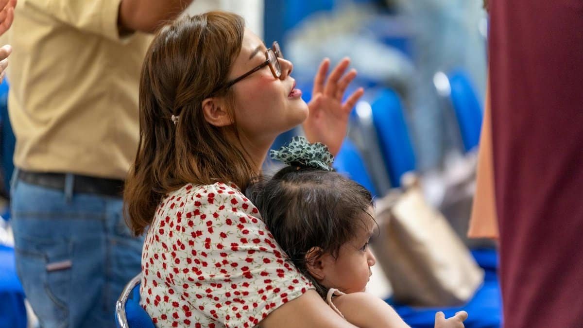A woman and her child participate in a religious service in Mexico City.