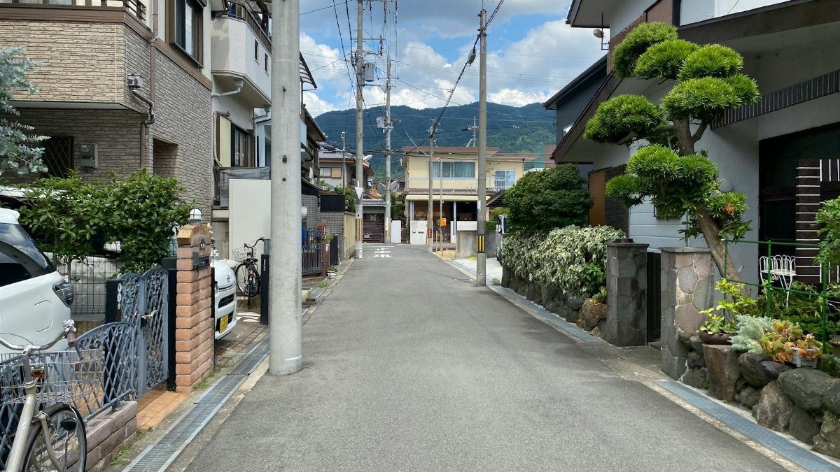 Quiet suburban street with traditional houses in Japan, showcasing a serene and organized neighborhood.