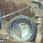Child fetching water from a well in Katsina, Nigeria, symbolizing rural life.