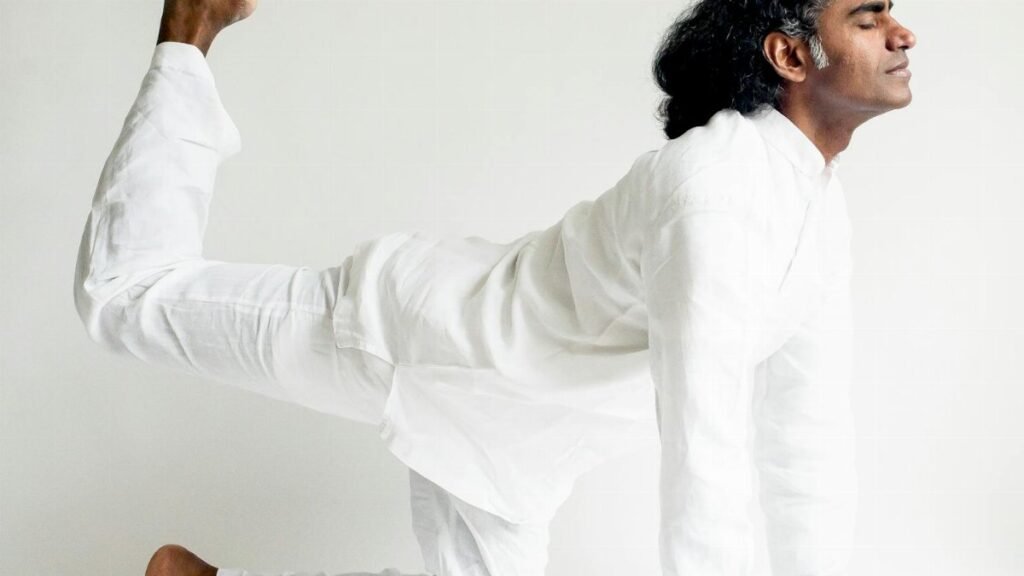 A yogi performing a balanced yoga pose, showcasing calm and concentration.