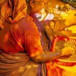 A vibrant depiction of daily life during a festival in Kodungallur, India. Captures cultural attire and activities.