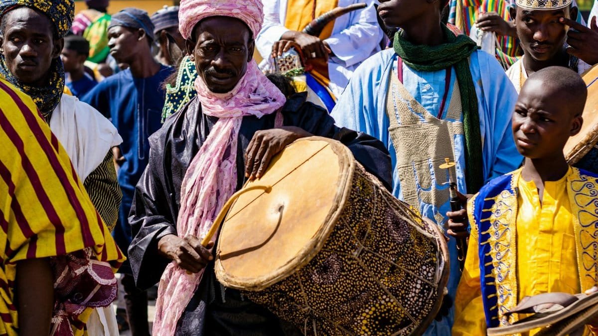 Vibrant cultural festival showcasing traditional African drumming and colorful attire.