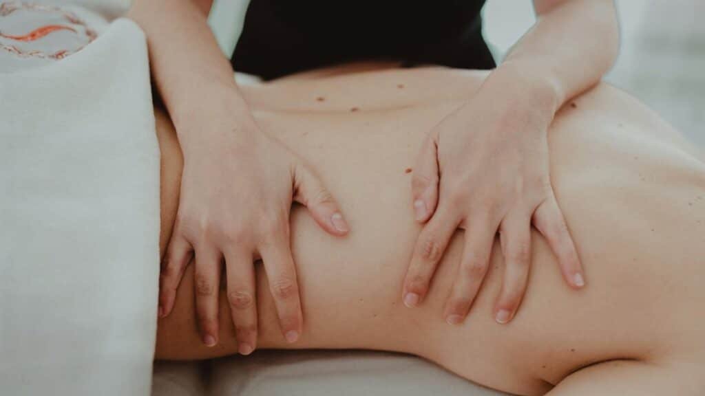 Close-up of a relaxing massage therapy session focusing on back treatment and stress relief.