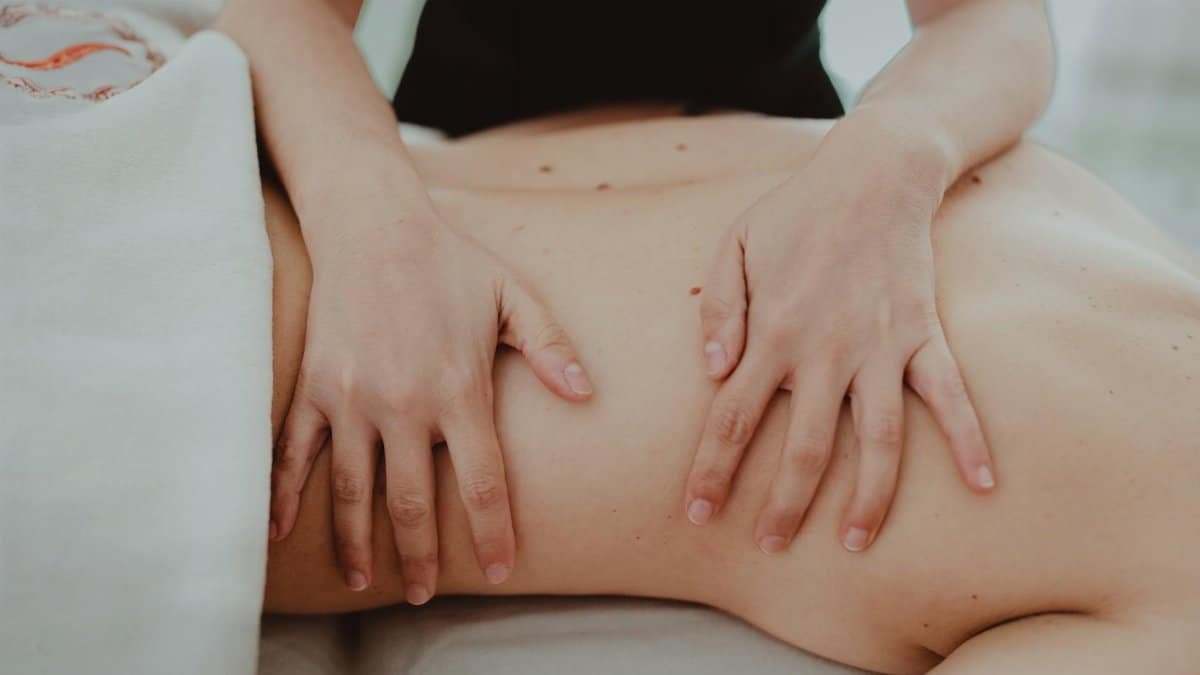 Close-up of a relaxing massage therapy session focusing on back treatment and stress relief.
