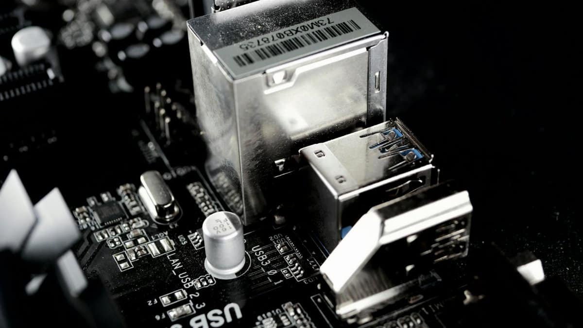 Detailed view of a circuit board featuring USB ports and electronic components.