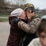 Heartfelt embrace in Makariv, Ukraine, capturing the emotional reunion.